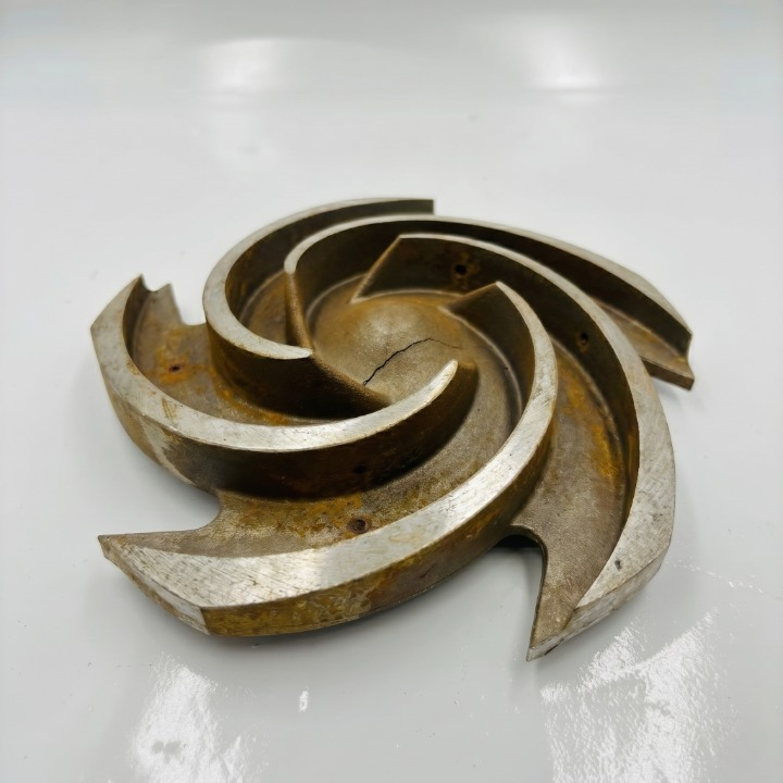 Broken original cast impeller with hub crack — chronic wear part failure case study